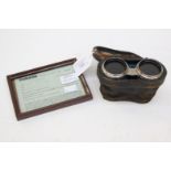 A pair of Jockey Club binoculars with silver hand grips, Jockey Club Paris on eye pieces,