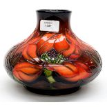 A Moorcroft painted flambe Magnolia pattern squat vase,