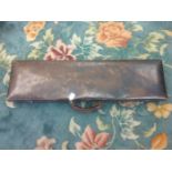 A leather gun case,