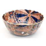 A late Victorian large Japanese Imari bowl (riveted repairs)