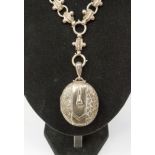 A Victorian silver front and back locket witha 'fancy' link chain, Birmingham 1890 approx 54.1gms/1.