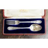 Red Morocco cased silver spoon and fork, Sheffield 1909/10,