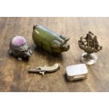 A silver pill box, white metal galleon, miniature gun,