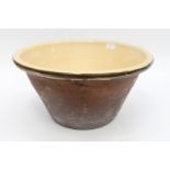 A large terracotta Dairy bowl, glazed internally, circa.