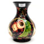 A Moorcroft vase in the Queens Choice pattern, designed by Emma Bossons, signed Kerri to base,