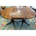 A reproduction twin pedestal dining table