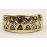 A cased 18ct gold ring set with diamond (tested) and trillion shape cabochon sapphires,