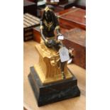 A well modelled bronze partially gilded, figure of a young Cleopatra seated,