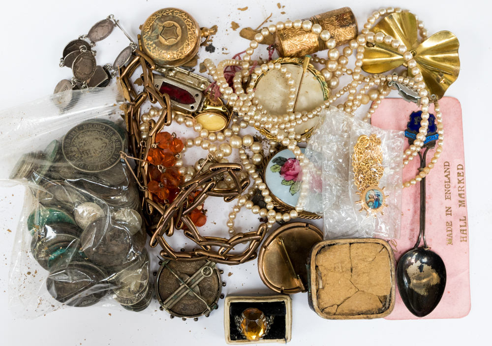 A bag of costume jewellery and coins, including a full sovereign and a half sovereign,