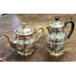 A small silver teapot,