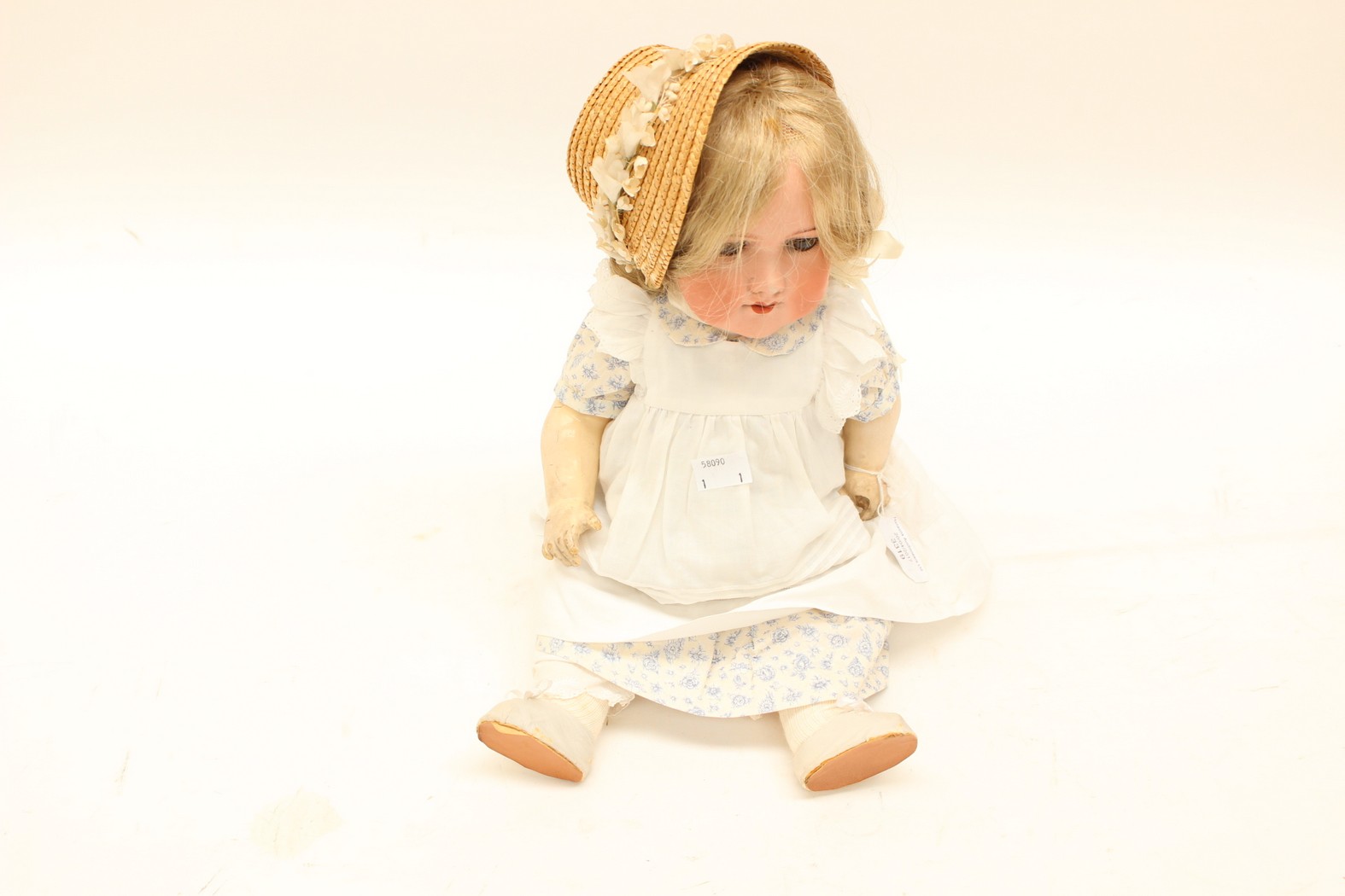 An Armand Marseille bisque head doll with opening and closing eyes (damage to fingers) Ref: