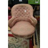 A Victorian pink upholstered nursing chair, buttoned back, sprung upholstered seat,