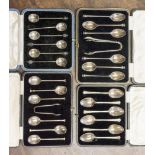 Four boxed sets of silver teaspoons, one set seal top style with sugar tongs, Sheffield 1926,