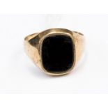 A 9ct gold cushion shape onyx set signet ring, size P, with a total gross weight approx 3.