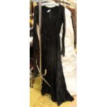 A black brocade wedding dress (dyed from original white) with full skirt late 1940s;