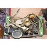 A box containing a collection of various brassware, including candlesticks, tray, figures,