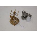 A silver plated ESMO Spaniel car mascot and a gilt metal ring tidy (2)