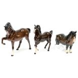 A Beswick Bay Stallion, tail attached to rear leg and front leg raised,