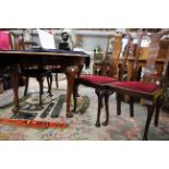 An Edwardian mahogany dining suite, comprising a set of four dining chairs,