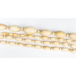 A long string of graduated ivory beads,