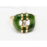A jadeite and diamond set 18ct gold ring,