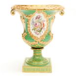 A large Coalport campana vase, circa 1845, relief moulded foliate handles and garland cartouches,