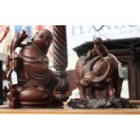 Two hardwood Oriental figures comprising a Buddha,