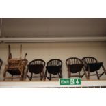 A pair of early Victorian walnut balloon back chairs, pierced backs, standing on cabriole legs,