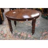 A late Victorian mahogany extending dining table, of oval form,