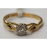 A solitaire diamond ring, illusion set in white metal, possibly 18ct, marks unclear,
