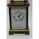 A late Victorian brass carriage clock, made by Finnigan, Manchester, bevelled edge glass,