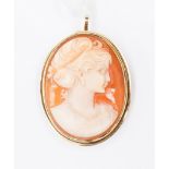 An Italian early 20th century shell cameo set in yellow metal, can be worn as a brooch or pendant,