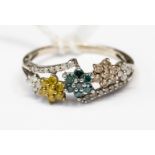 A white yellow and blue diamond set multi cluster white gold ring, ring size S 1/2,