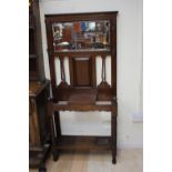 An early 20th Century oak hall stand, mirrored back,