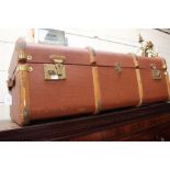 An early 20th Century oak bound travelling trunk canvas body