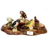 Five Beswick garden birds on Beswick stand