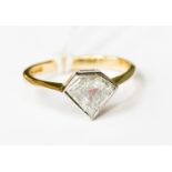 A solitaire diamond ring in 18ct gold, set Pentagon - cut diamond,
