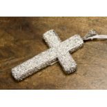 A Cantonese white metal embossed crucifix pendant, weighing approx 1.