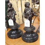 A pair of bronze effect cast iron figures in 19th century French style,