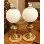 A pair of oil lamps - brass bases
