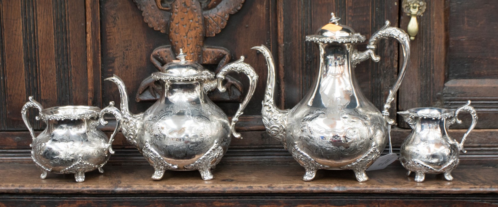 A four piece EPNS tea service with engraved design,