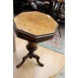 A Victorian walnut octagonal work table, fitted interior,