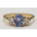 A Ceylon sapphire and diamond three stone 18ct yellow gold ring,