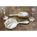 A pair of silver candlesticks, Birmingham 1972 with a silver brush and mirror set,