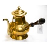 A Dutch Brass Coffe pot with a wooden handle. Circa 1750. Size 25.5cm high.