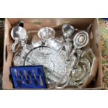 A box containing a collection of silver plated ware, including Victorian teapot, entree dish,