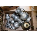 A quantity of Continental pewter beer jugs with lids,