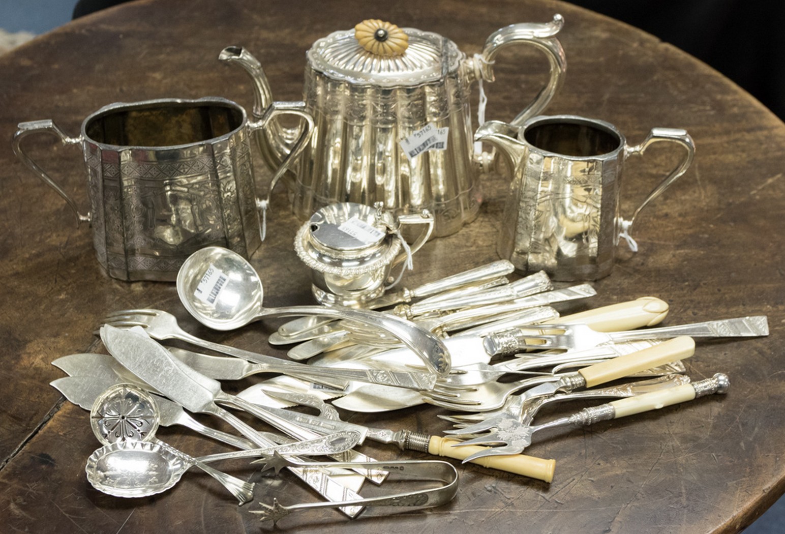 A set of six silver handled dessert knives - Sheffield 1925 with a silver butter knife, London 1897,