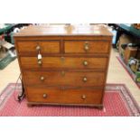 A George III oak and mahogany chest of drawers,
