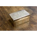 An Edwardian silver cigar box, planished form with vacant cartouche to the top,